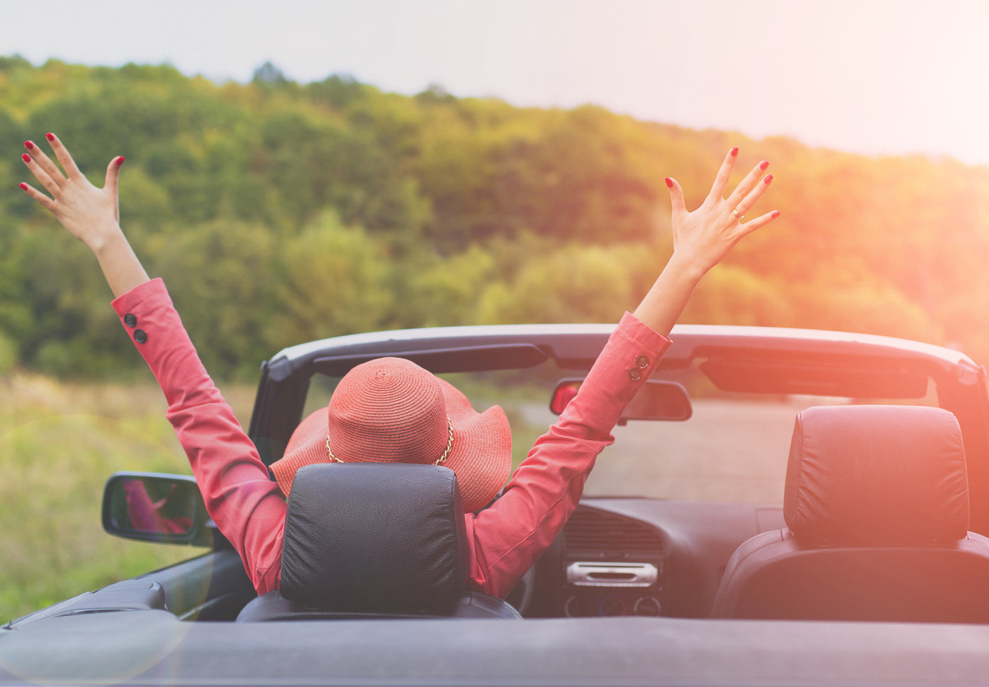 Summer road trip with urinary incontinence | CU Urogynecology | Woman in convertible